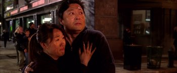 Movie still from “Spider-Man 2” (2004), directed by Sam Raimi – A man and a woman looking at the camera; Medium shot, Low angle