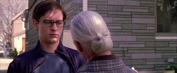 Movie still from “Spider-Man 2” (2004), directed by Sam Raimi – An older woman talking to a young man; Close Up shot, Over the shoulder angle
