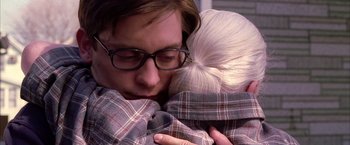 Movie still from “Spider-Man 2” (2004), directed by Sam Raimi – A man and a woman snuggled up to each other; Close Up shot, Over the shoulder angle