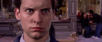 Movie still from “Spider-Man 2” (2004), directed by Sam Raimi – A man's face in a room; Extreme Close Up shot, Over the shoulder angle