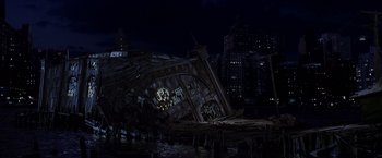 Movie still from “Spider-Man 2” (2004), directed by Sam Raimi – A building that has fallen down into the water; Extreme Wide shot, Low angle