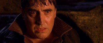 Movie still from “Spider-Man 2” (2004), directed by Sam Raimi – A man's face in the dark; Close Up shot, Low angle