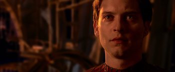 Movie still from “Spider-Man 2” (2004), directed by Sam Raimi – A man's face in the dark; Close Up shot, Low angle