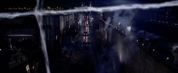 Movie still from “Spider-Man 2” (2004), directed by Sam Raimi – A train is traveling down the tracks at night; Extreme Wide shot, High angle