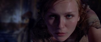 Movie still from “Spider-Man 2” (2004), directed by Sam Raimi – A woman's face in the dark; Close Up shot, Low angle