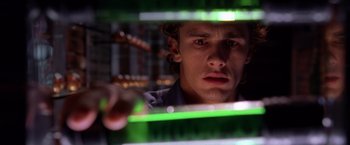 Movie still from “Spider-Man 2” (2004), directed by Sam Raimi – A person looking through a window; Close Up shot, Low angle
