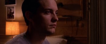 Movie still from “Spider-Man 2” (2004), directed by Sam Raimi – A person looking at the camera; Close Up shot, Over the shoulder angle