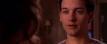 Movie still from “Spider-Man 2” (2004), directed by Sam Raimi – A young man's face in front of a mirror; Close Up shot, Over the shoulder angle