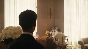 Movie still from “Mr. Robot” (2015), created by Sam Esmail – A man sitting in front of a mirror in front of another man; Medium shot, Over the shoulder angle
