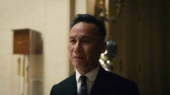 Movie still from “Mr. Robot” (2015), created by Sam Esmail – A person wearing a suit and tie; Close Up shot, Low angle