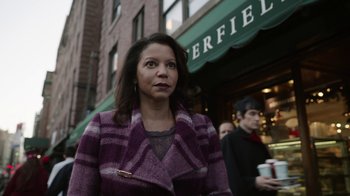 Movie still from “Mr. Robot” (2015), created by Sam Esmail – A woman in a purple coat is walking down the street; Close Up shot, Over the shoulder angle