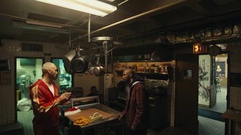 Movie still from “Mr. Robot” (2015), created by Sam Esmail – Two men are in a kitchen talking to each other; Wide shot, High angle