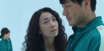 Movie still from “Squid Game” (2021), created by Hwang Dong-hyuk – A man and a woman looking at one another; Close Up shot, Over the shoulder angle