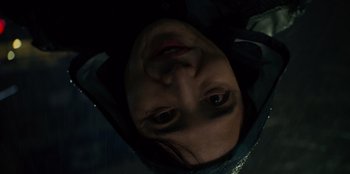 Movie still from “Squid Game” (2021), created by Hwang Dong-hyuk – A woman's face in the dark; Close Up shot, Overhead angle