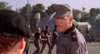 Movie still from “Starship Troopers” (1997), directed by Paul Verhoeven – Close Up shot, Over the shoulder angle