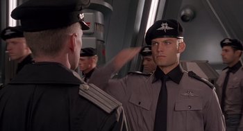 Movie still from “Starship Troopers” (1997), directed by Paul Verhoeven – Medium shot, Low angle
