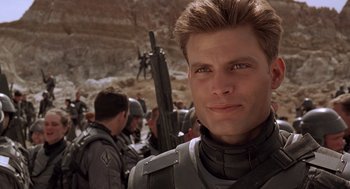 Movie still from “Starship Troopers” (1997), directed by Paul Verhoeven – Close Up shot, Over the shoulder angle