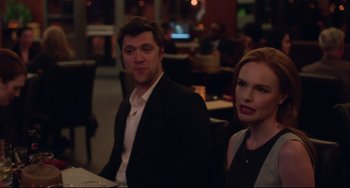 Movie still from “Still Alice” (2014), directed by Richard Glatzer – A man and a woman sitting at a dinner table; Medium shot, Over the shoulder angle