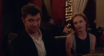 Movie still from “Still Alice” (2014), directed by Richard Glatzer – A man and a woman sitting next to each other at a table; Close Up shot, Over the shoulder angle