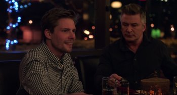 Movie still from “Still Alice” (2014), directed by Richard Glatzer – Two men sitting at a table in front of each other; Medium shot, Over the shoulder angle