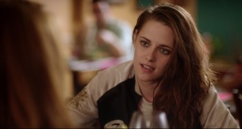 Movie still from “Still Alice” (2014), directed by Richard Glatzer – A woman sitting at a table with a glass of wine; Close Up shot, Over the shoulder angle