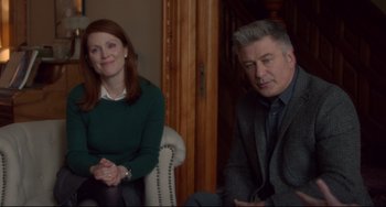 Movie still from “Still Alice” (2014), directed by Richard Glatzer – A man and a woman sitting next to each other in a room; Medium shot, Over the shoulder angle