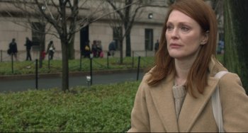 Movie still from “Still Alice” (2014), directed by Richard Glatzer – A person wearing a coat near a tree; Close Up shot, Over the shoulder angle