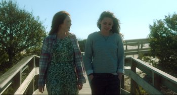 Movie still from “Still Alice” (2014), directed by Richard Glatzer – Two young women walking on a wooden bridge; Medium shot, Low angle