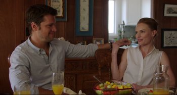 Movie still from “Still Alice” (2014), directed by Richard Glatzer – A man and a woman sitting in front of a bowl of fruit; Medium shot, Over the shoulder angle