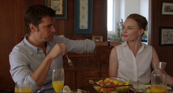 Movie still from “Still Alice” (2014), directed by Richard Glatzer – A man and a woman sitting in front of a bowl of fruit; Medium shot, Over the shoulder angle