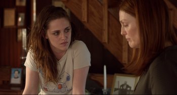 Movie still from “Still Alice” (2014), directed by Richard Glatzer – Two women sitting in front of each other in front of a candle; Medium shot, Over the shoulder angle