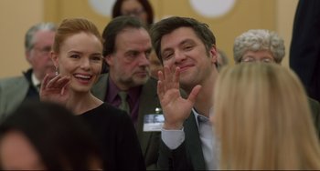 Movie still from “Still Alice” (2014), directed by Richard Glatzer – A group of people that are standing around a room; Medium shot, Over the shoulder angle