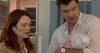 Movie still from “Still Alice” (2014), directed by Richard Glatzer – A man and a woman looking at a baby; Close Up shot, Over the shoulder angle