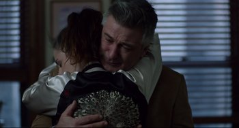 Movie still from “Still Alice” (2014), directed by Richard Glatzer – A man and a woman hugging each other in a dark room; Close Up shot, Over the shoulder angle