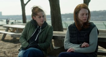 Movie still from “Still Alice” (2014), directed by Richard Glatzer – Two women sitting on a bench near a body of water; Medium shot, Over the shoulder angle