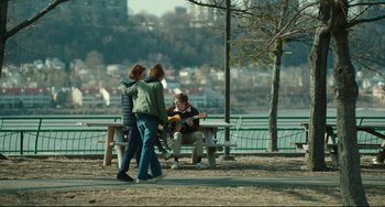 Movie still from “Still Alice” (2014), directed by Richard Glatzer – Two people are walking on a bench near a lake; Wide shot, Over the shoulder angle