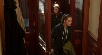 Movie still from “Still Alice” (2014), directed by Richard Glatzer – Two women are walking down the hall way of a building; Medium shot, Over the shoulder angle