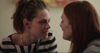 Movie still from “Still Alice” (2014), directed by Richard Glatzer – Two young women talking to each other in front of a wall; Close Up shot, Over the shoulder angle