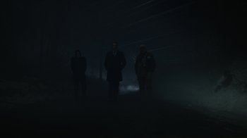 Movie still from “Mr. Robot” (2015), created by Sam Esmail – Three people standing in the dark in the fog; Wide shot, Low angle