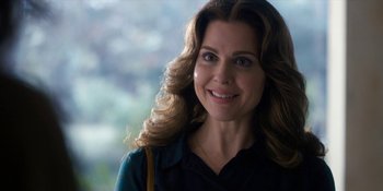 Movie still from “Stranger Things” (2016), created by Ross Duffer – A person with long brown hair; Close Up shot, Over the shoulder angle