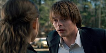 Movie still from “Stranger Things” (2016), created by Ross Duffer – A man and a woman talking to each other outside; Close Up shot, Over the shoulder angle