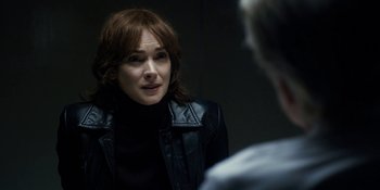 Movie still from “Stranger Things” (2016), created by Ross Duffer – A woman in a leather jacket talking to a man; Close Up shot, Over the shoulder angle