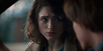 Movie still from “Stranger Things” (2016), created by Ross Duffer – A person looking at the camera; Close Up shot, Over the shoulder angle