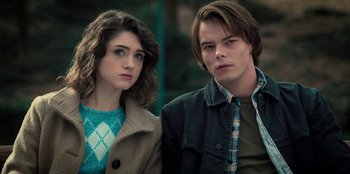 Movie still from “Stranger Things” (2016), created by Ross Duffer – A man and a woman standing next to each other; Close Up shot, Over the shoulder angle