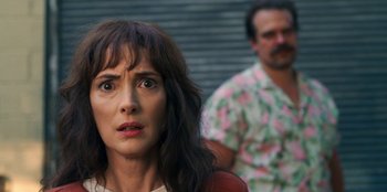 Movie still from “Stranger Things” (2016), created by Ross Duffer – A person sitting in front of another person; Close Up shot, Over the shoulder angle