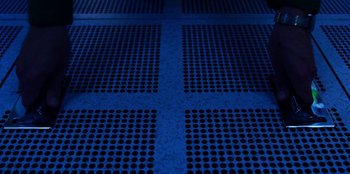 Movie still from “Stranger Things” (2016), created by Ross Duffer – View of a blue floor with a pattern; Extreme Wide shot, Overhead angle