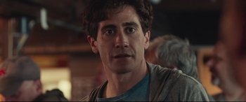 Movie still from “Stronger” (2017), directed by David Gordon Green – A person wearing a shirt; Close Up shot, Over the shoulder angle