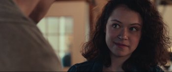 Movie still from “Stronger” (2017), directed by David Gordon Green – A woman smiling at the camera; Close Up shot, Over the shoulder angle
