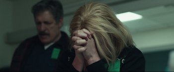 Movie still from “Stronger” (2017), directed by David Gordon Green – A woman covering her face with her hands; Close Up shot, Over the shoulder angle