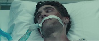 Movie still from “Stronger” (2017), directed by David Gordon Green – A person laying in a hospital bed; Close Up shot, High angle